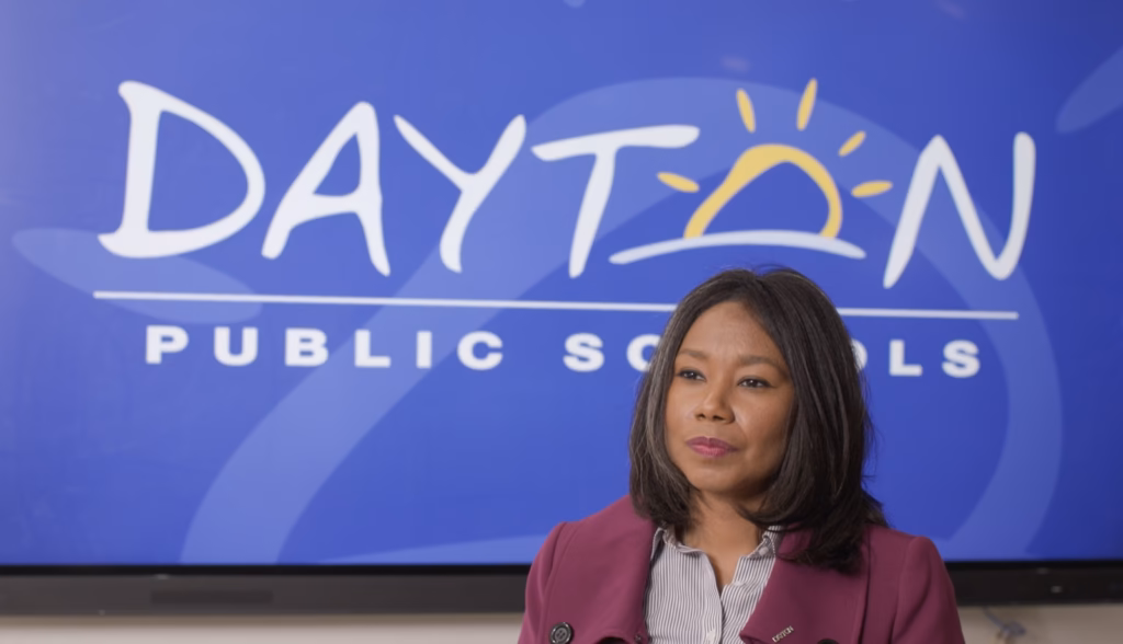 Dayton Public Schools documentary interview in front of the district logo